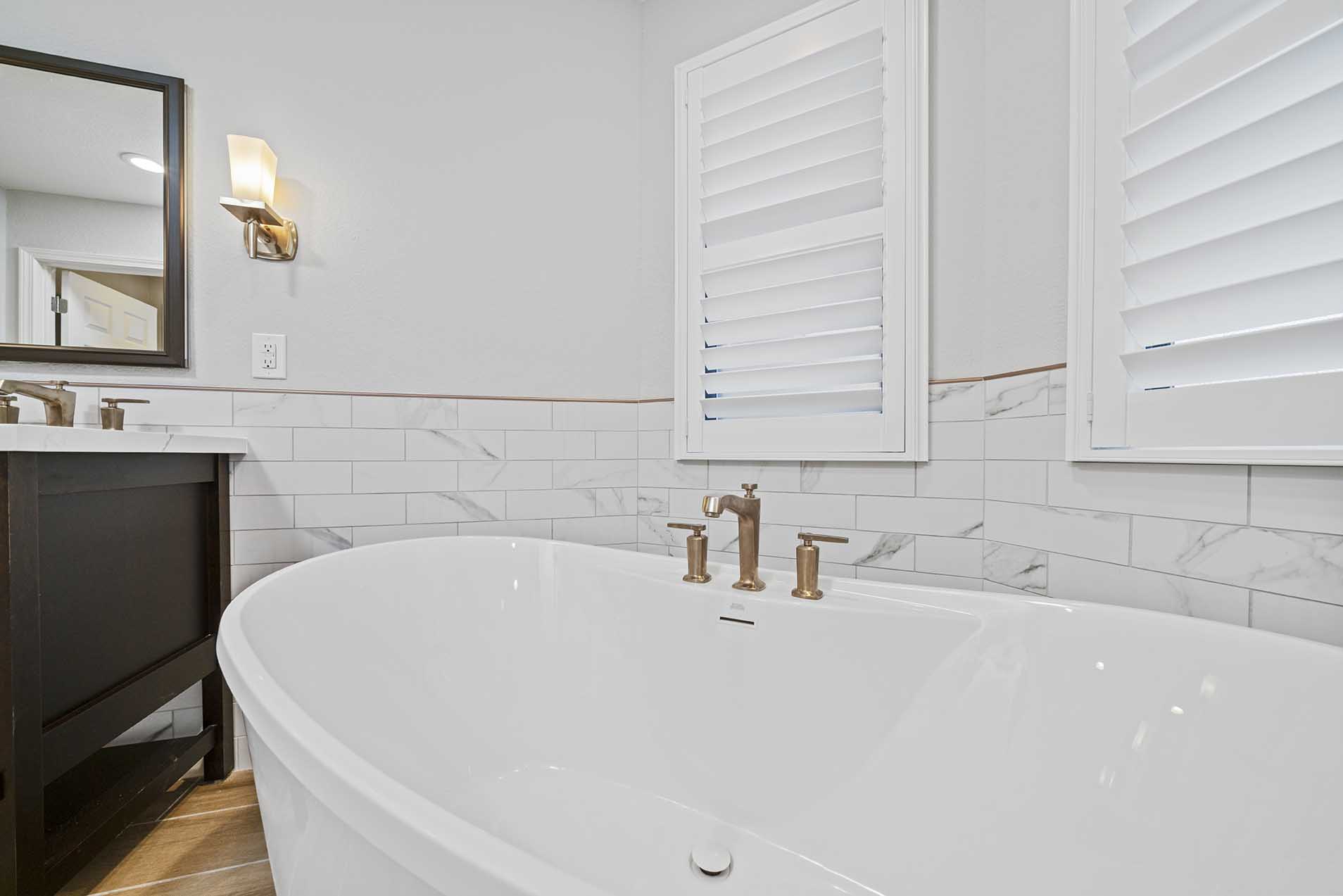 New freestanding soaking tub installed in master bathroom