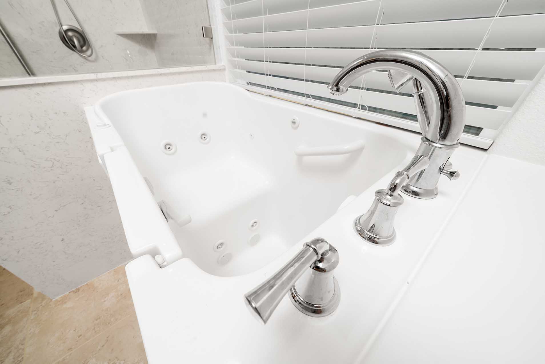 Updated bathroom layout with walk-in tub for independent living