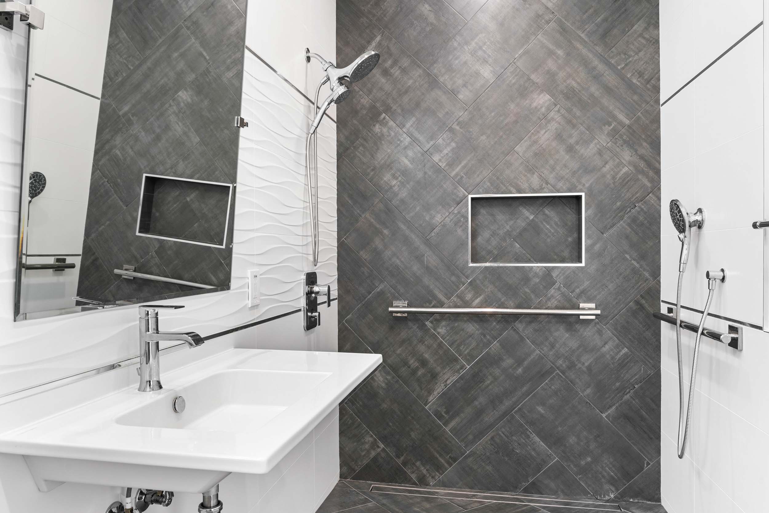 Bathroom remodel featuring ADA shower with built-in niche and grab bars in Sacramento, CA 95829