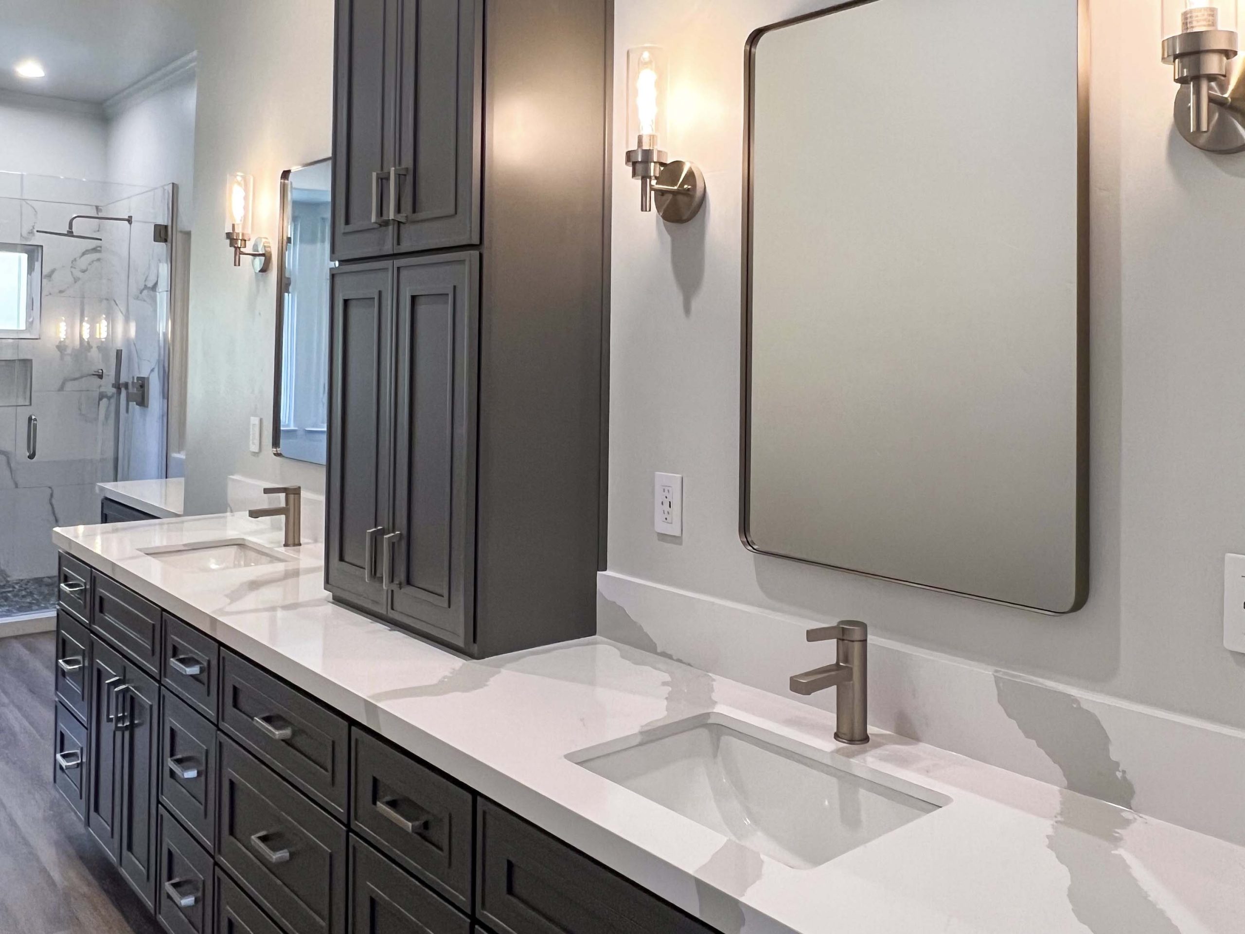 Custom dual-sink vanity with quartz countertop, center storage tower, and modern fixtures in Granite Bay, CA 95746