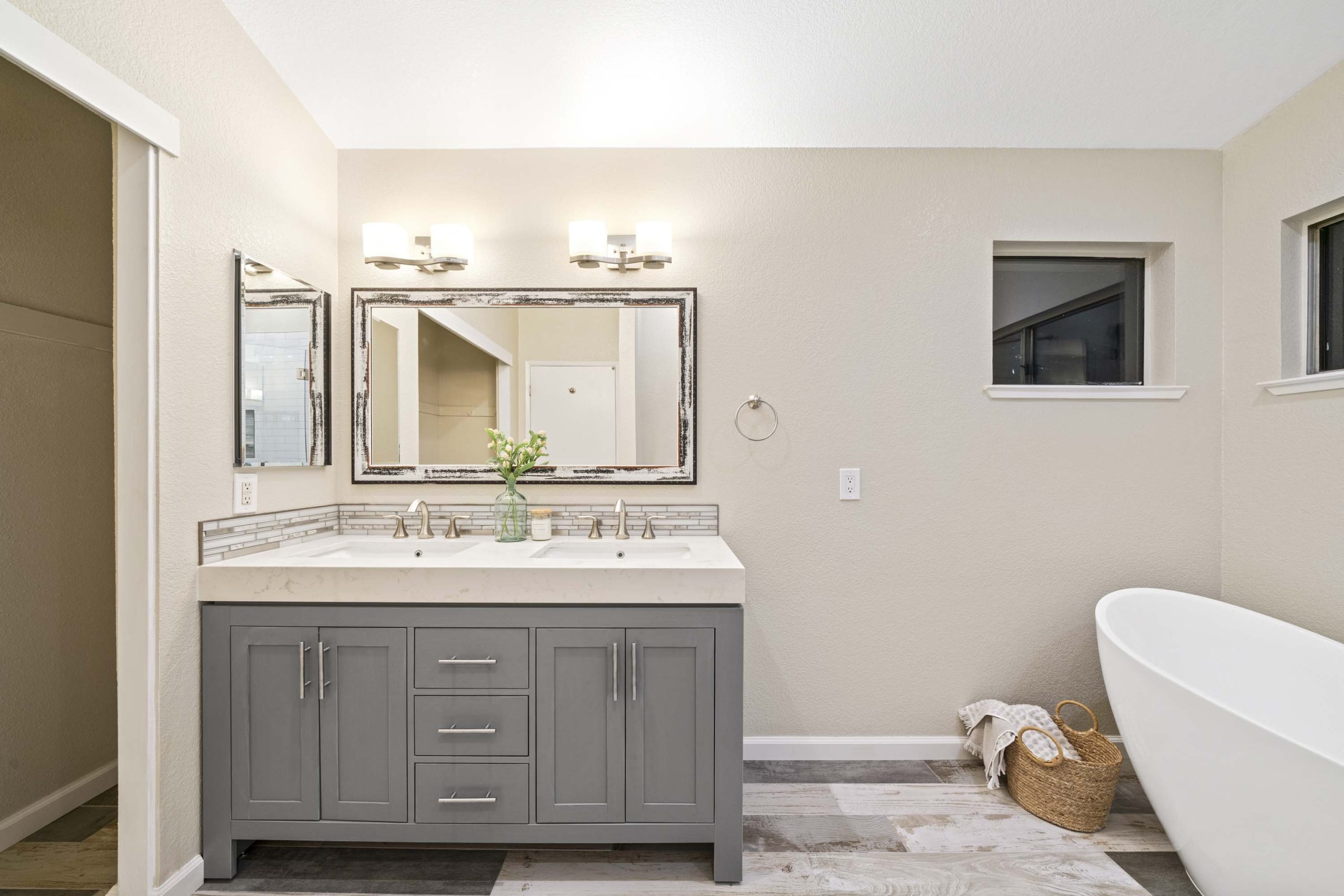 Double-sink vanity with quartz countertop and custom cabinetry in Roseville CA 95678