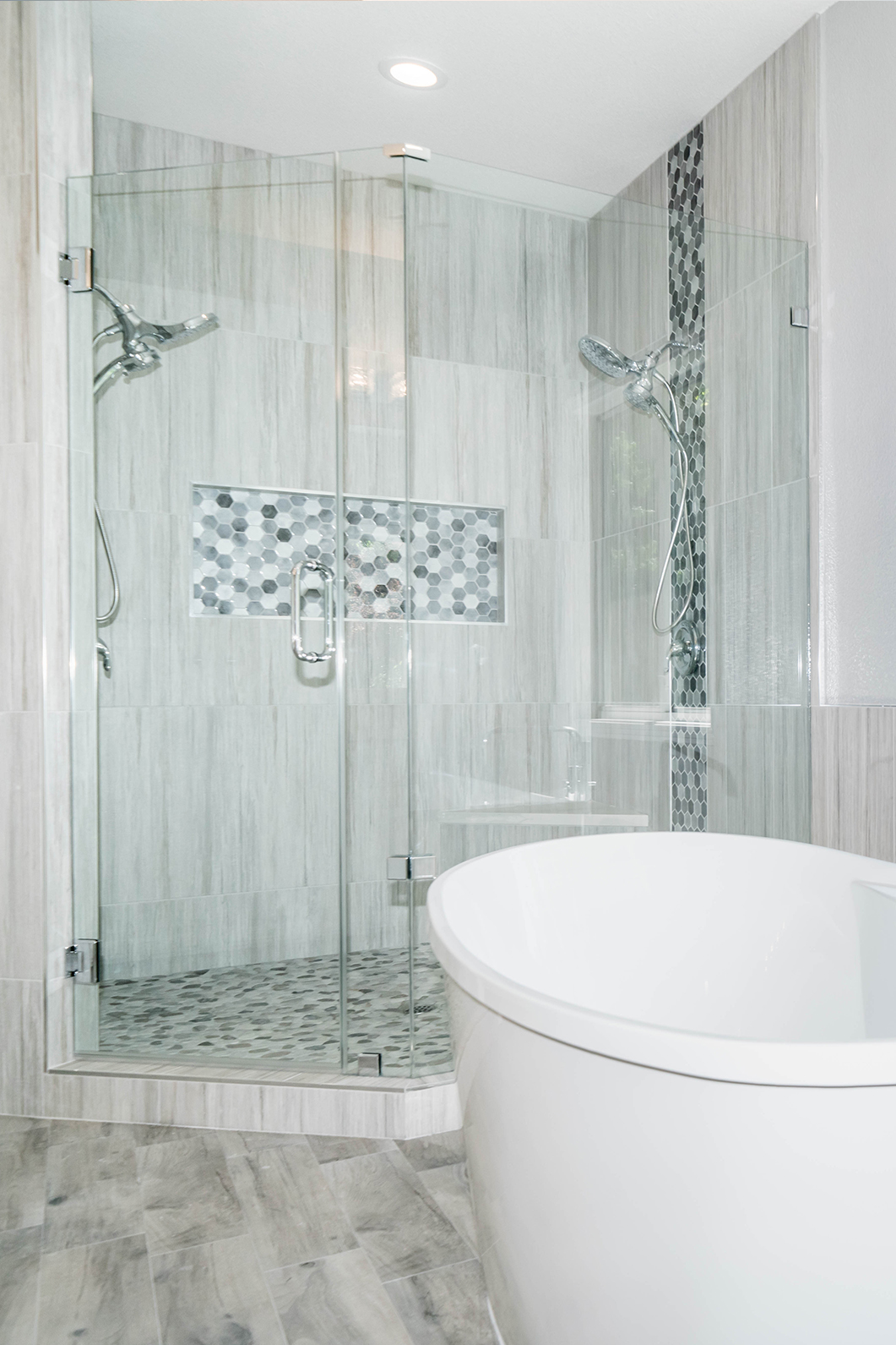 Frameless glass shower and soaking tub in a Sacramento, CA 95831 master bathroom remodel