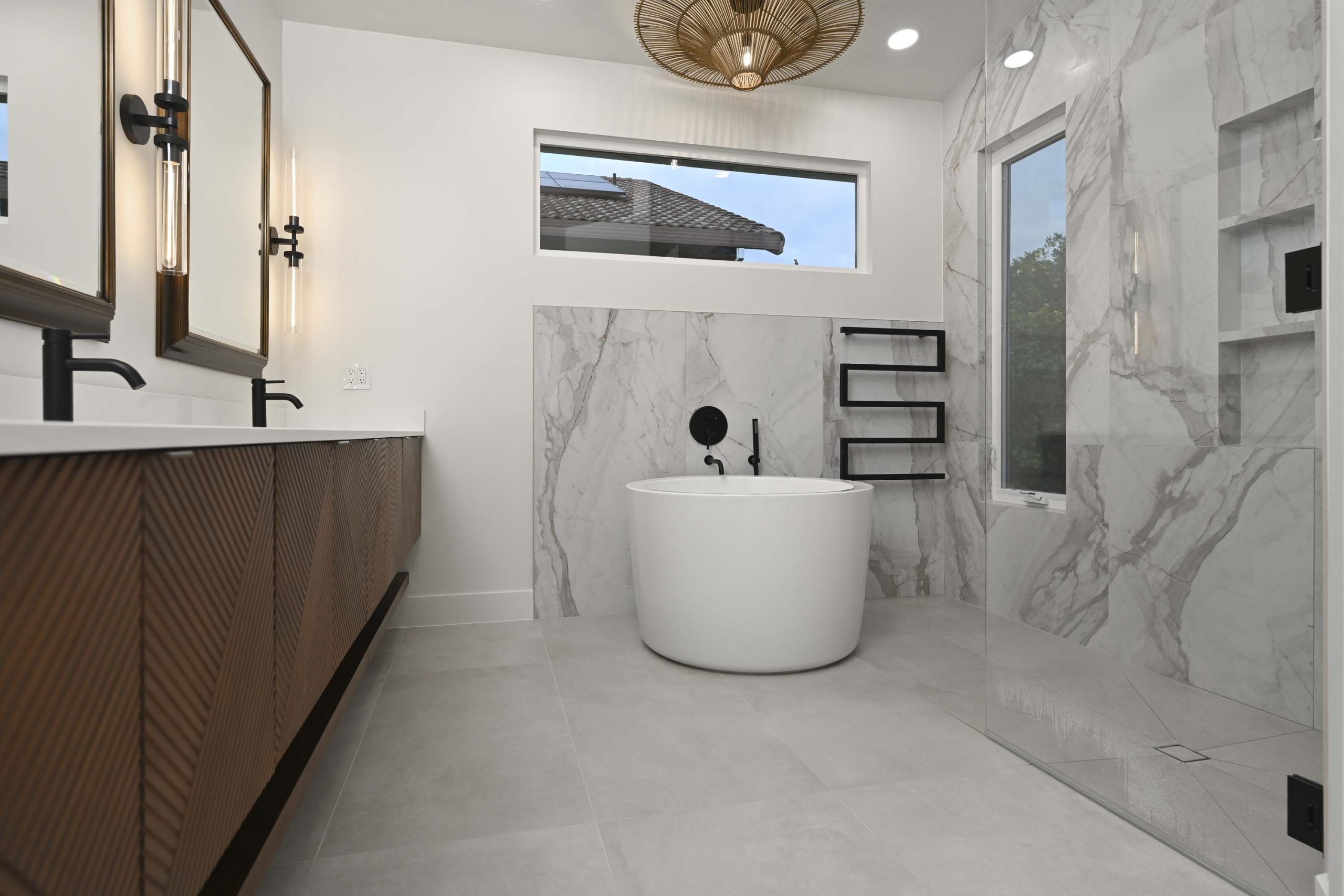 Freestanding soaking tub with custom vanity and frameless glass shower in Elk Grove, CA 95624