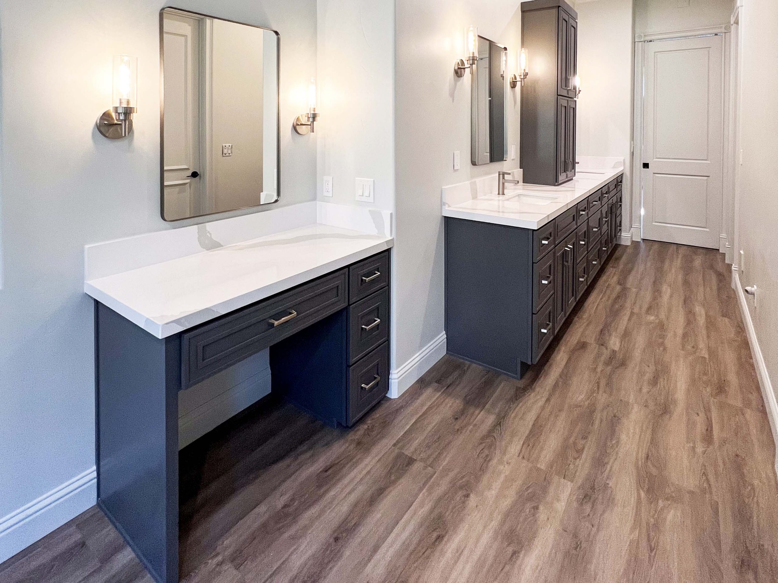 Makeup vanity and extended dual-sink bathroom cabinetry with quartz countertops in Granite Bay, CA 95746
