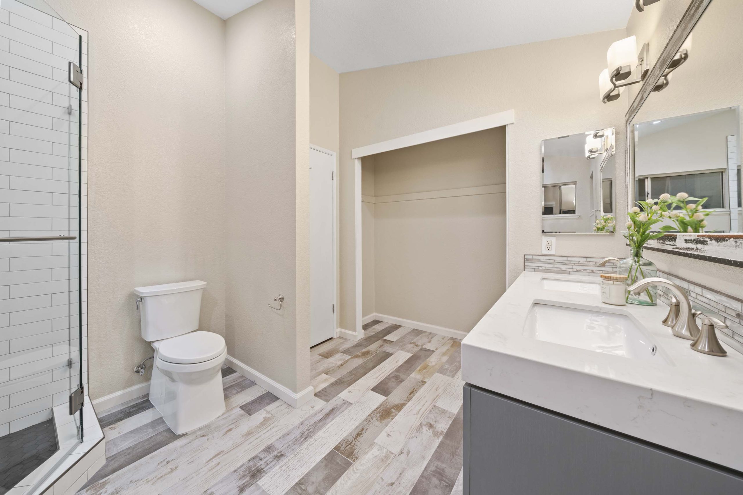 Master bathroom overview showing vanity, shower, and closet access in Roseville, CA 95678