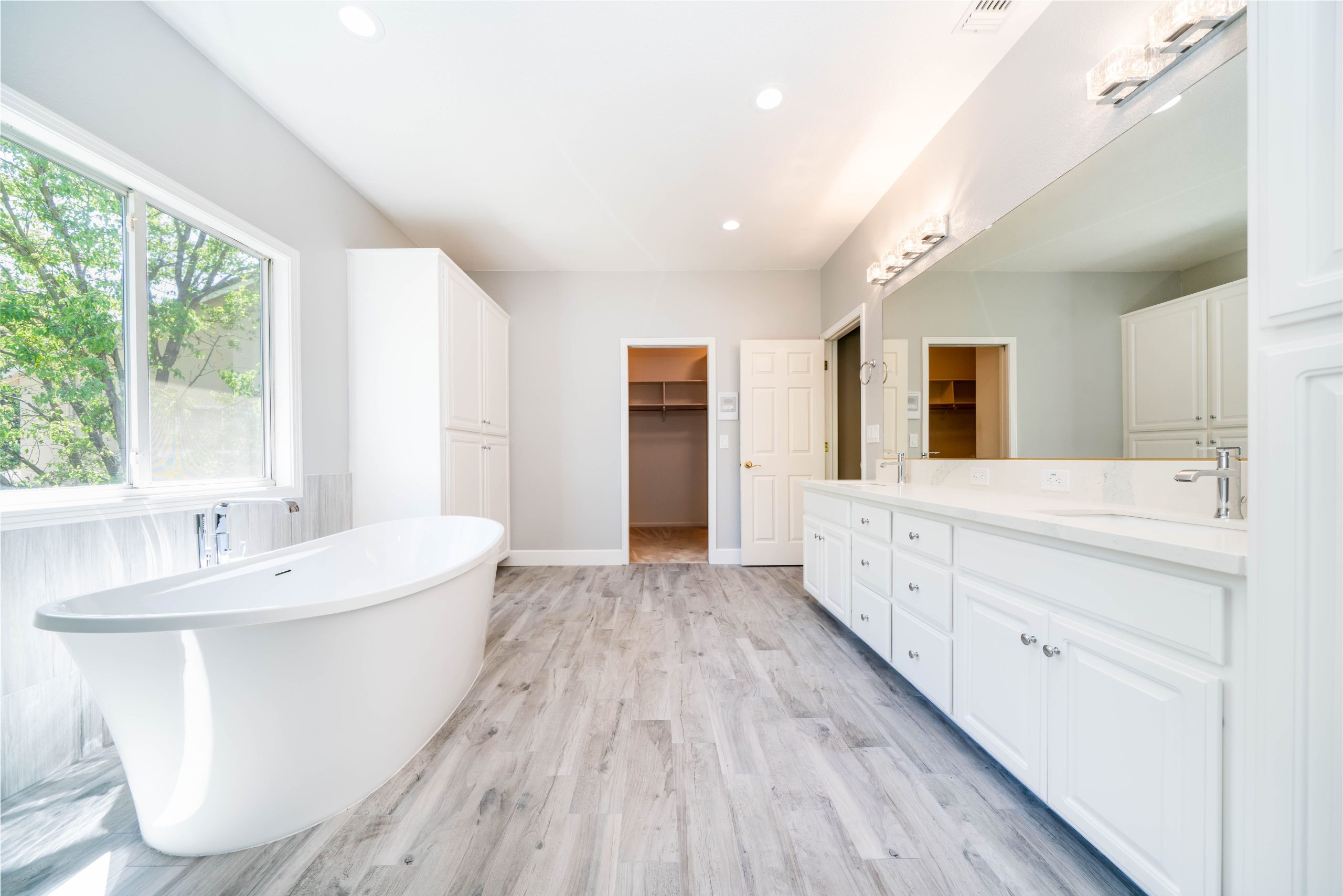Open master bathroom layout remodel in Sacramento, CA 95831 with tub and double vanity