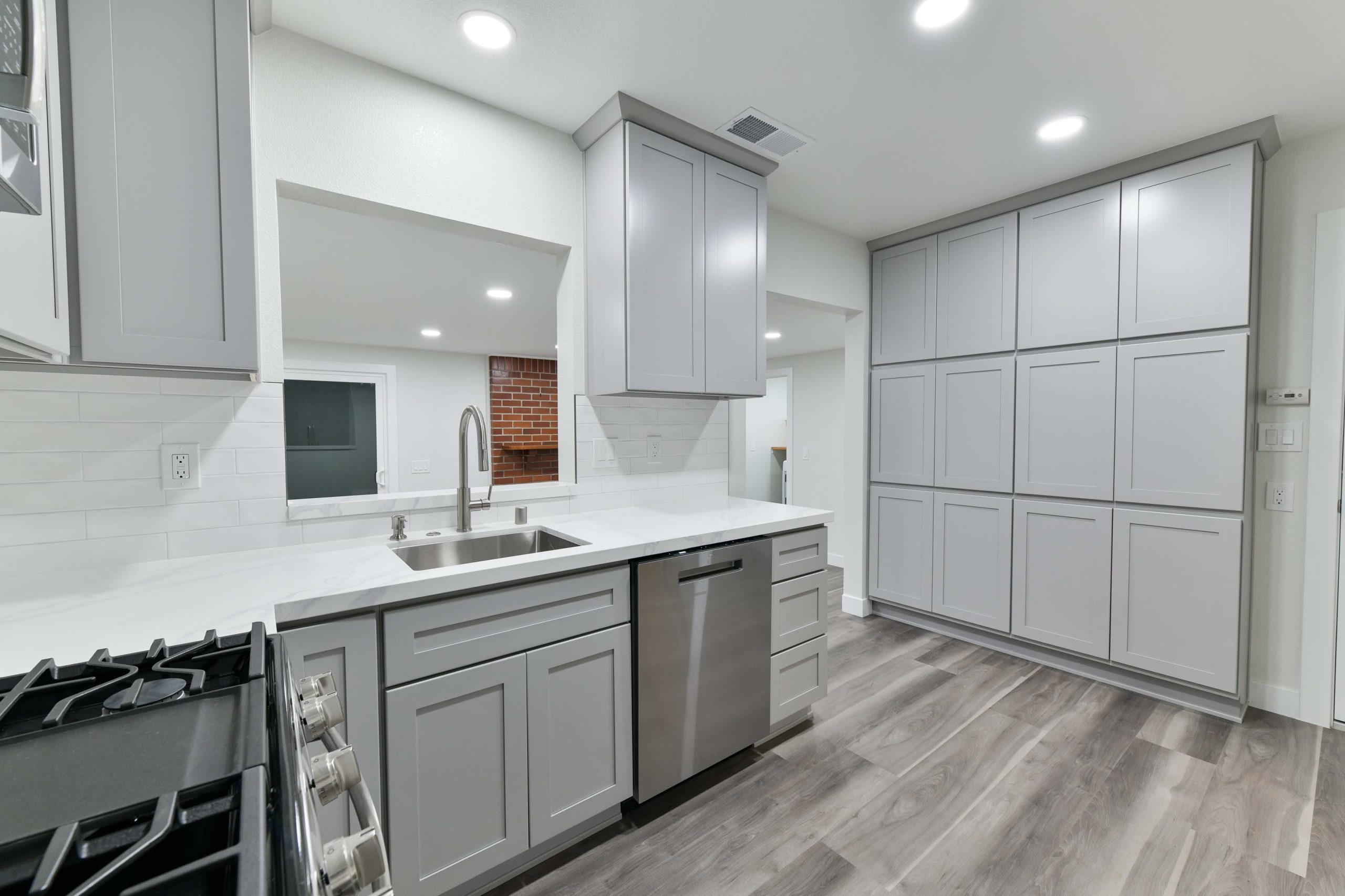 Open kitchen connection to the living area with improved flow and visibility.