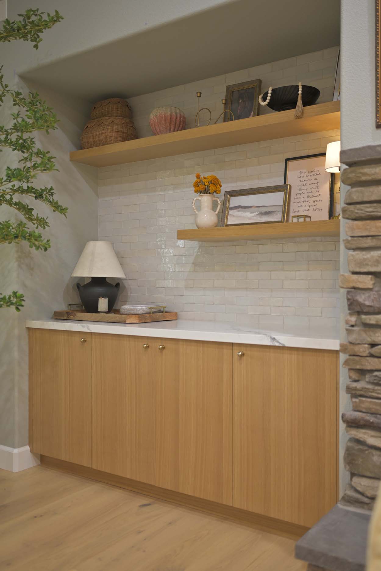 Kitchen remodel in Elk Grove, CA 95758 featuring a built in buffet with custom wood cabinetry, floating shelves, white countertops, and a light tile backsplash.