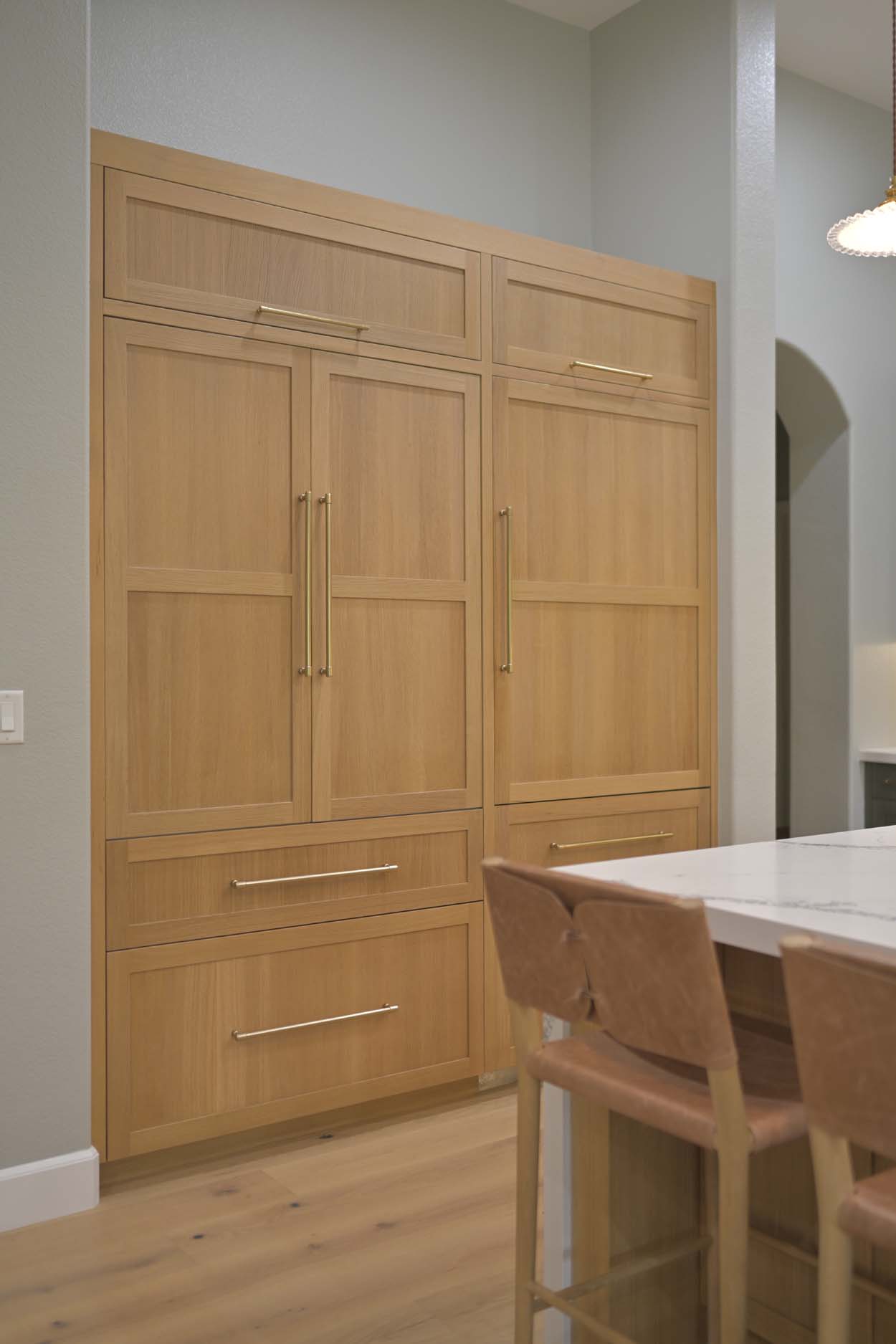 Kitchen remodel in Elk Grove, CA 95758 showcasing tall custom wood pantry cabinets with integrated storage.