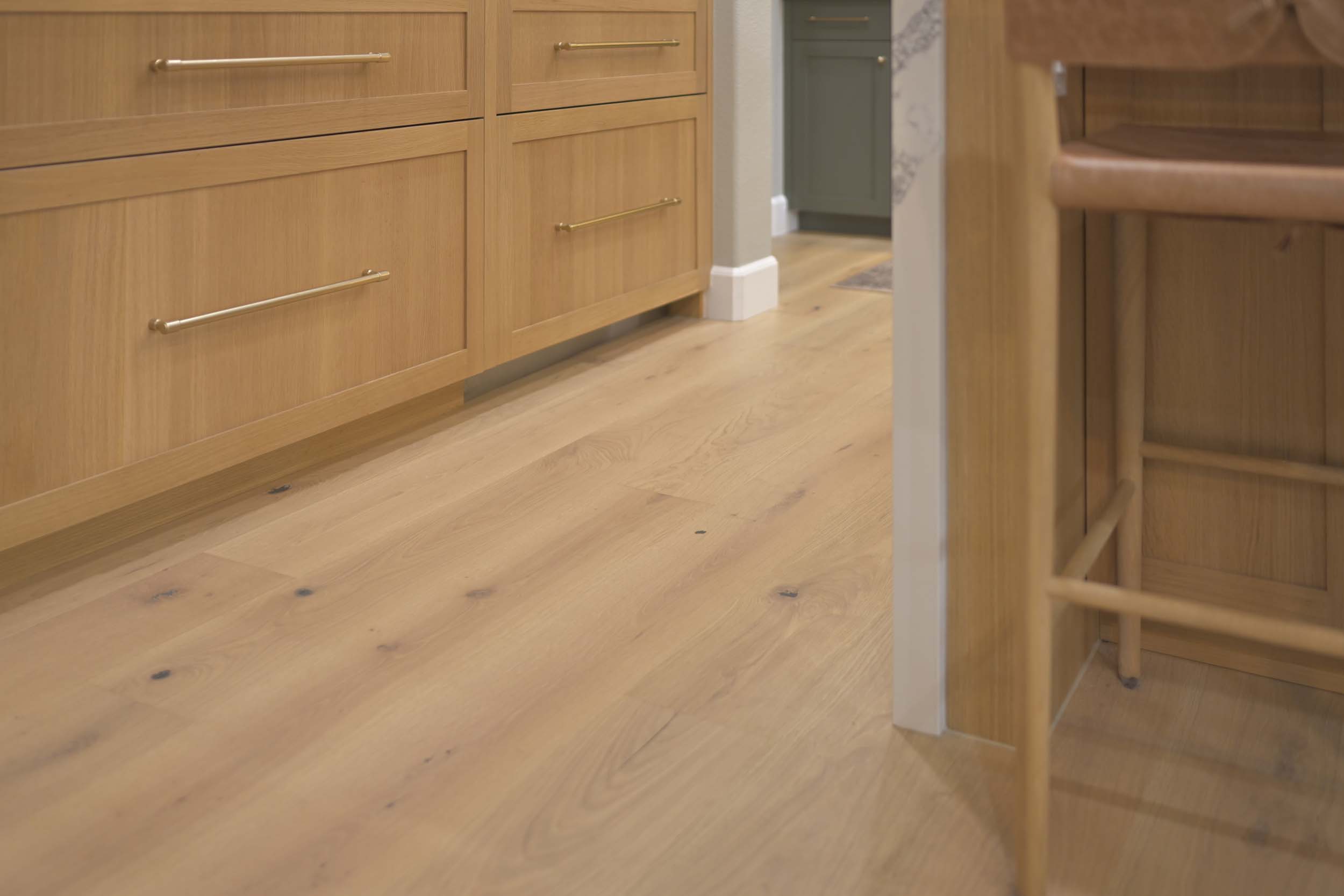 Kitchen remodel in Elk Grove, CA 95758 featuring wide plank wood flooring and warm natural finishes throughout the space.