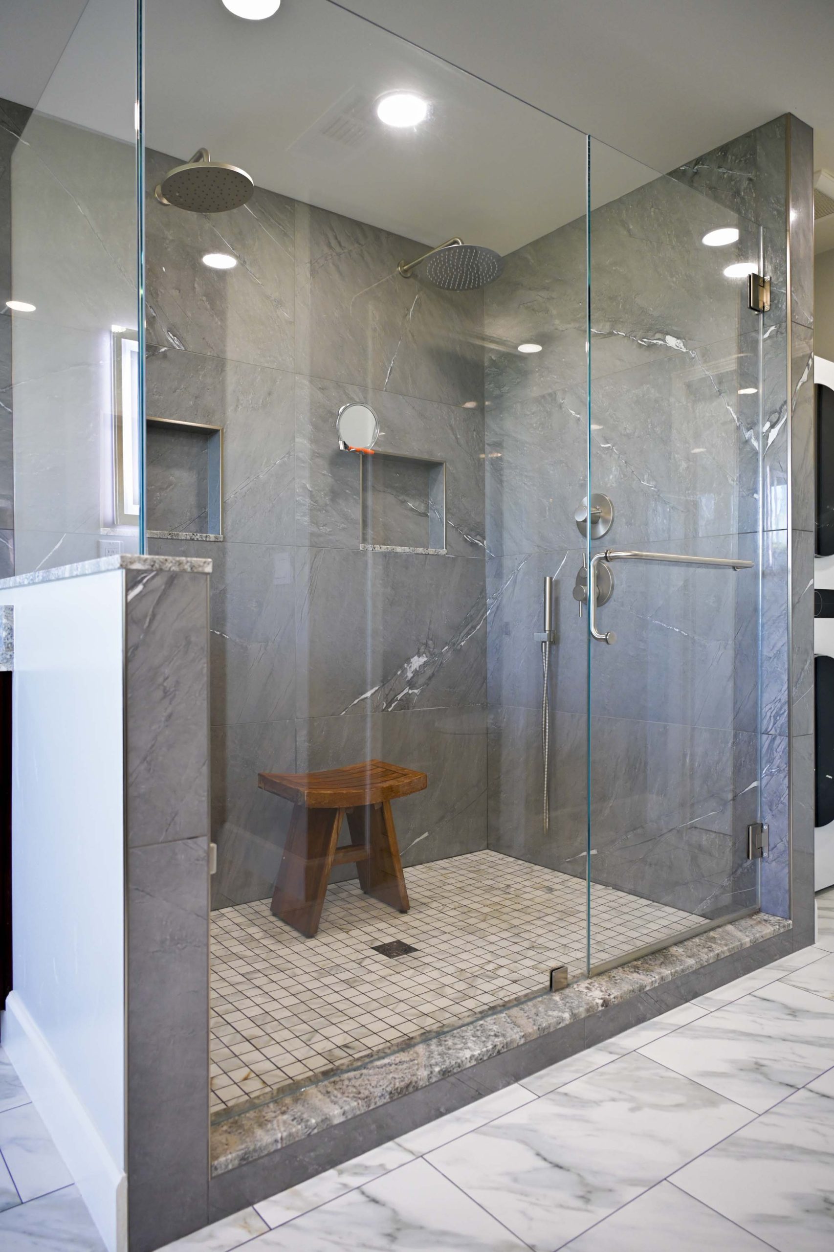Frameless glass walk in shower with gray porcelain tile in a master bathroom remodel in Rocklin, CA 95765