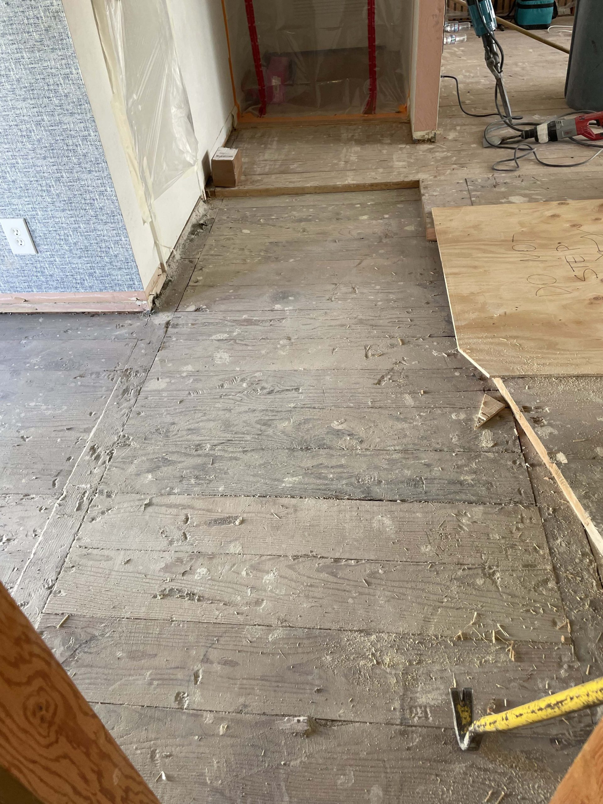 Exposed original subfloor showing the two different floor heights that were discovered and leveled during the Roseville kitchen remodel