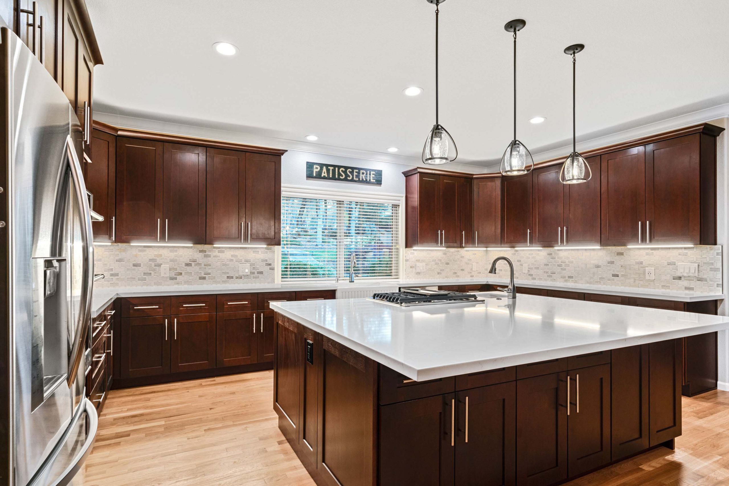 Bright Kitchen with Dark Wood Cabinets and White Island Auburn CA 95602 Email Hero
