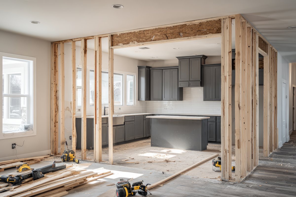 Gutted interior with open wall framing during remodeling older homes Sacramento project
